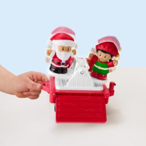 Fisher-Price Little People Musical Christmas Train toy with Santa, elf and reindeer figures on a table.