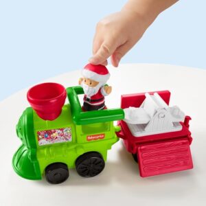 Fisher-Price Little People Musical Christmas Train toy with Santa, elf and reindeer figures on a table.